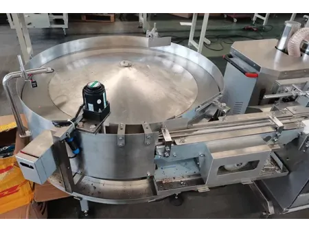 Sistema automático de envasado con alimentador de doble tolva